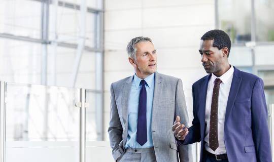 Two males having a business meeting.