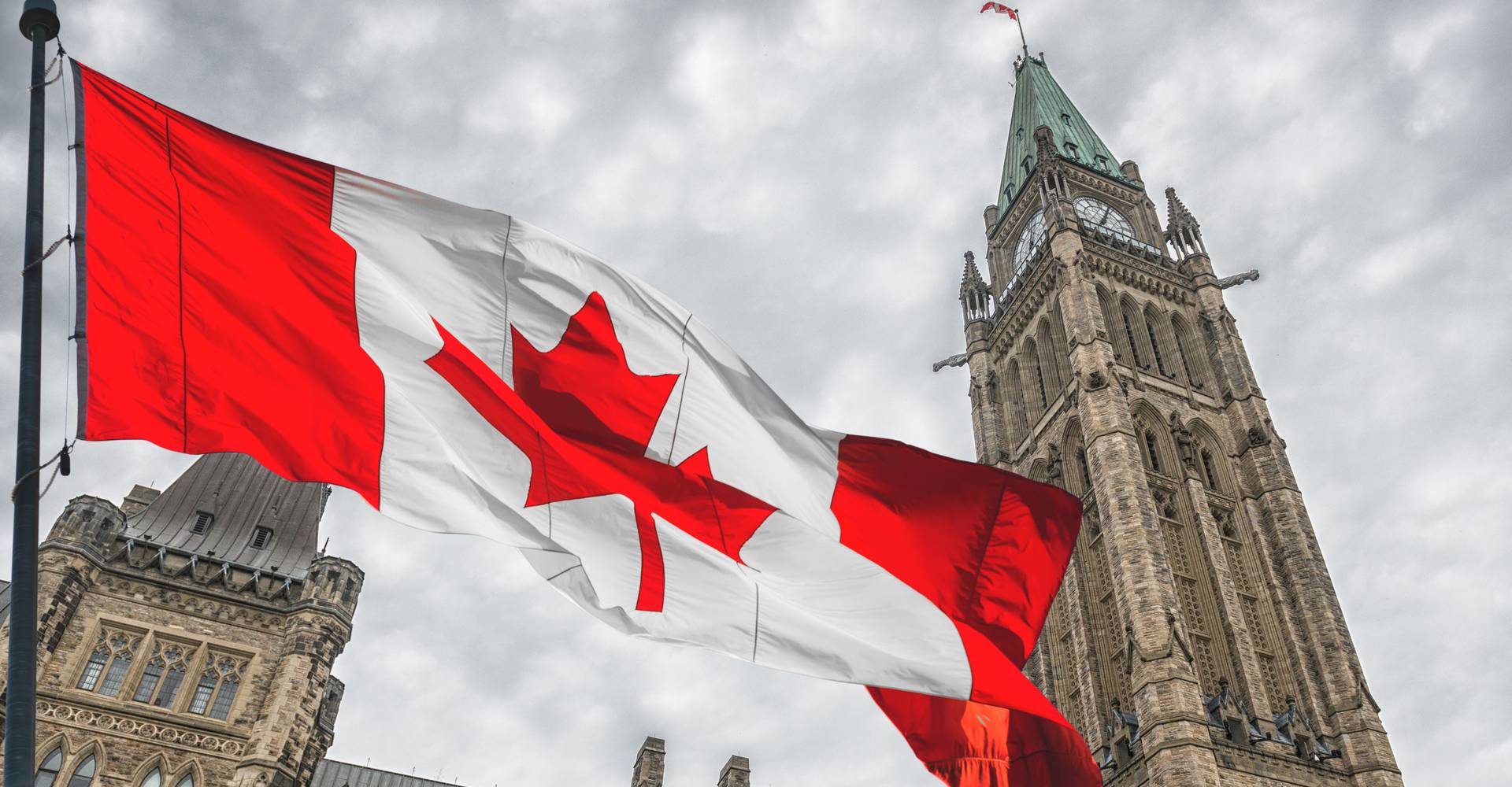 Canada flag flying outside the Parliament buildings in Ottawa.