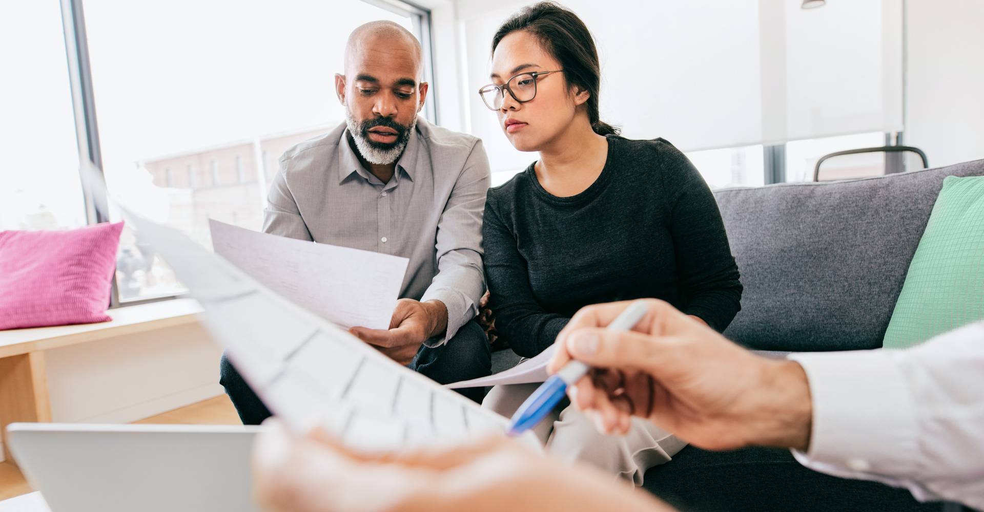 Team members reviewing a document in a casual meeting space