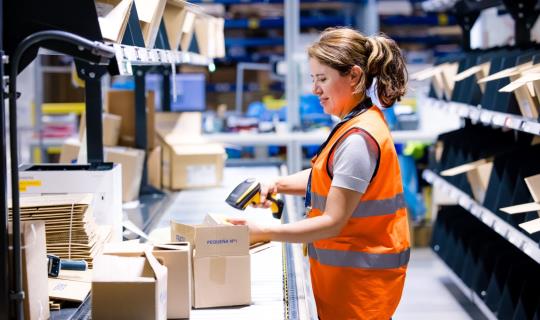 Distribution center team member preparing a shipment.