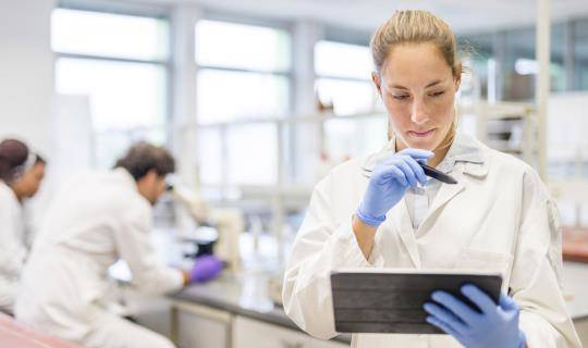 Female scientist working with a digital tablet in the laboratory