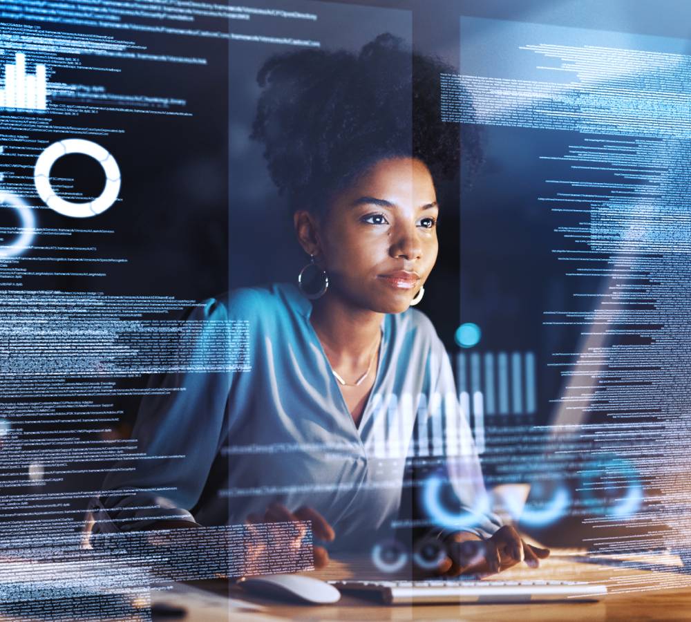 Shot of a programmer working on a computer code at night