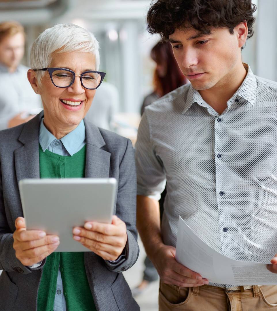 Colleagues sharing tablet