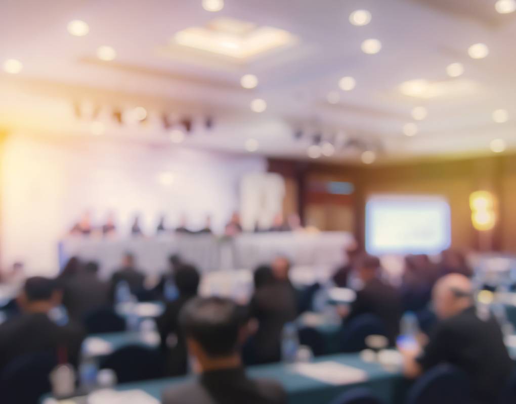 Defocused Image Of Business People At Seminar