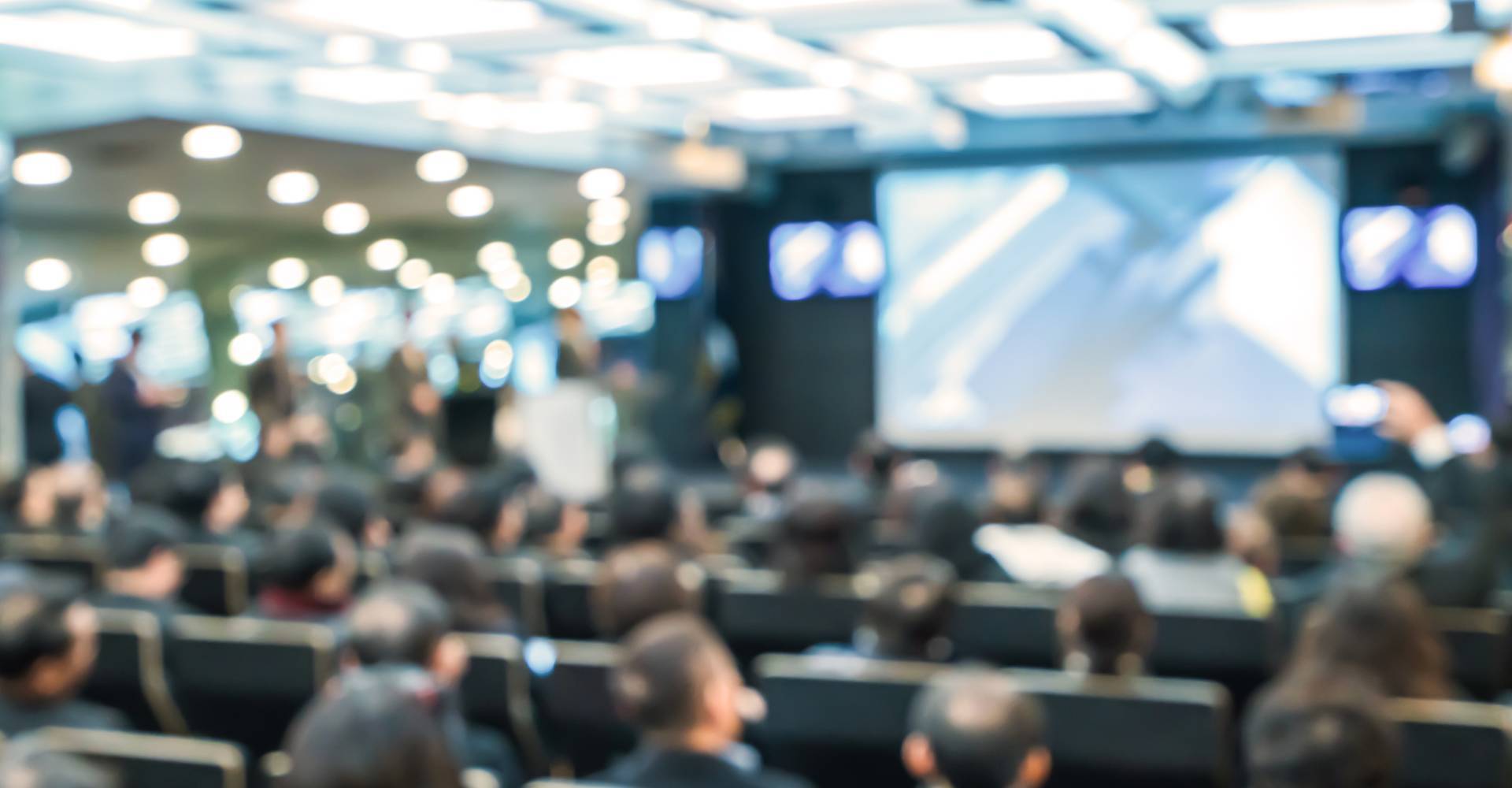 People Sitting On Chairs In Seminar